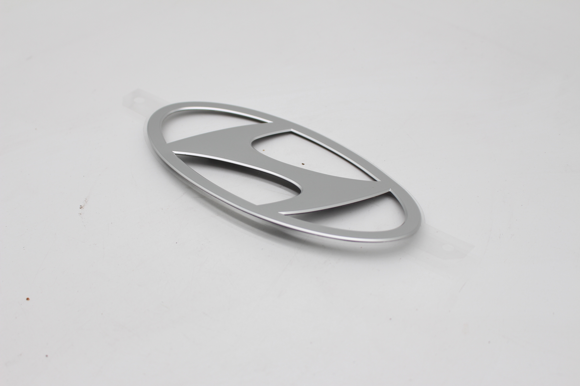 Hyundai IONIQ 6 Stoßstangen Emblem Silber 86305KL200